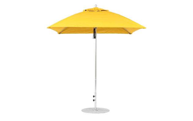 The Essential Fiberglass Umbrella - 7.5 Square Pulley by Ledge Lounger is a yellow patio umbrella with marine-grade fabric, featuring a silver pole and round base, showcased upright against a white background.