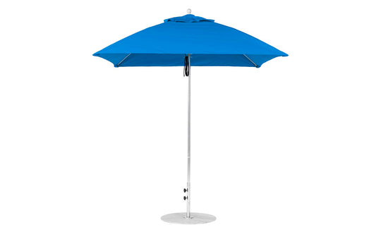 The Ledge Lounger Essential Fiberglass Umbrella, a 7.5 square pulley in blue with a silver pole and round base, is open. Made from marine-grade fabric, its smooth, minimalist design ensures durability and provides shade on sunny days.