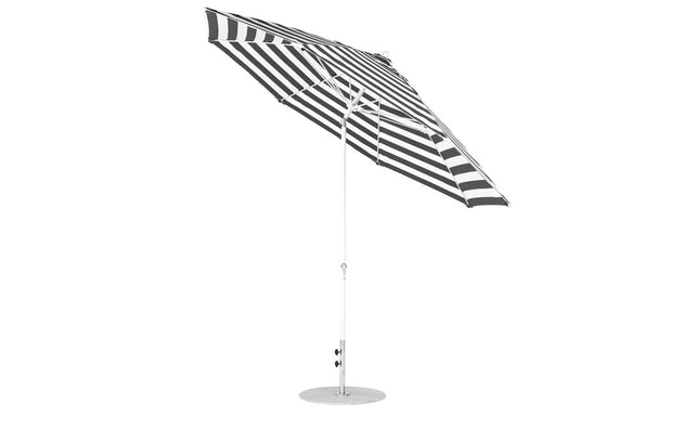 A Ledge Lounger Essential Fiberglass Umbrella - 11 Octagon Crank Auto Tilt, featuring black and white stripes, stands open with a thin aluminum pole. The umbrella is tilted to one side against a plain white background, highlighting its sleek marine-grade fabrics.
