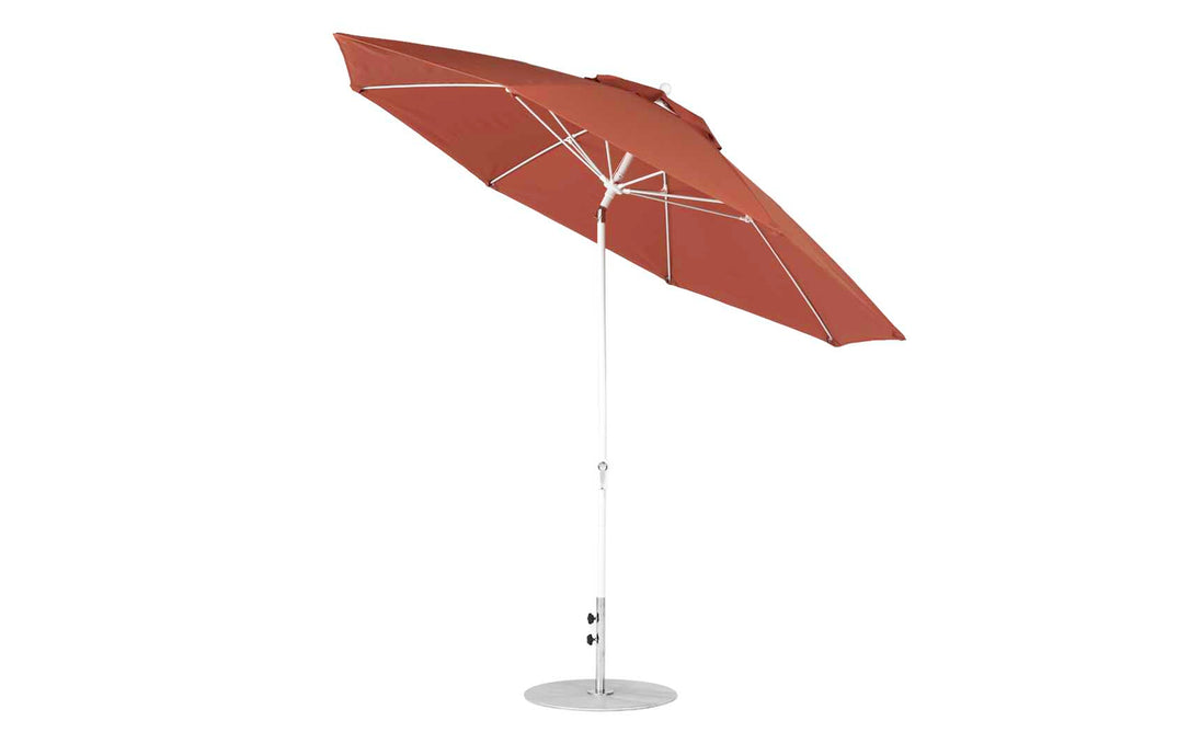 The Ledge Lounger Essential Fiberglass Umbrella - 11 Octagon Crank Auto Tilt features a large red canopy with marine-grade fabrics for durable shade, an aluminum center pole with a circular base, and an adjustable tilt mechanism for enhanced comfort.