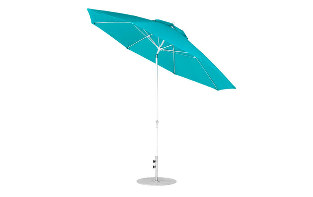 The Essential Fiberglass Umbrella - 11 Octagon Crank Auto Tilt by Ledge Lounger boasts a turquoise marine-grade fabric canopy, an aluminum center pole, and a metallic base. Its minimalist design provides ample shade, perfect for sunny days.