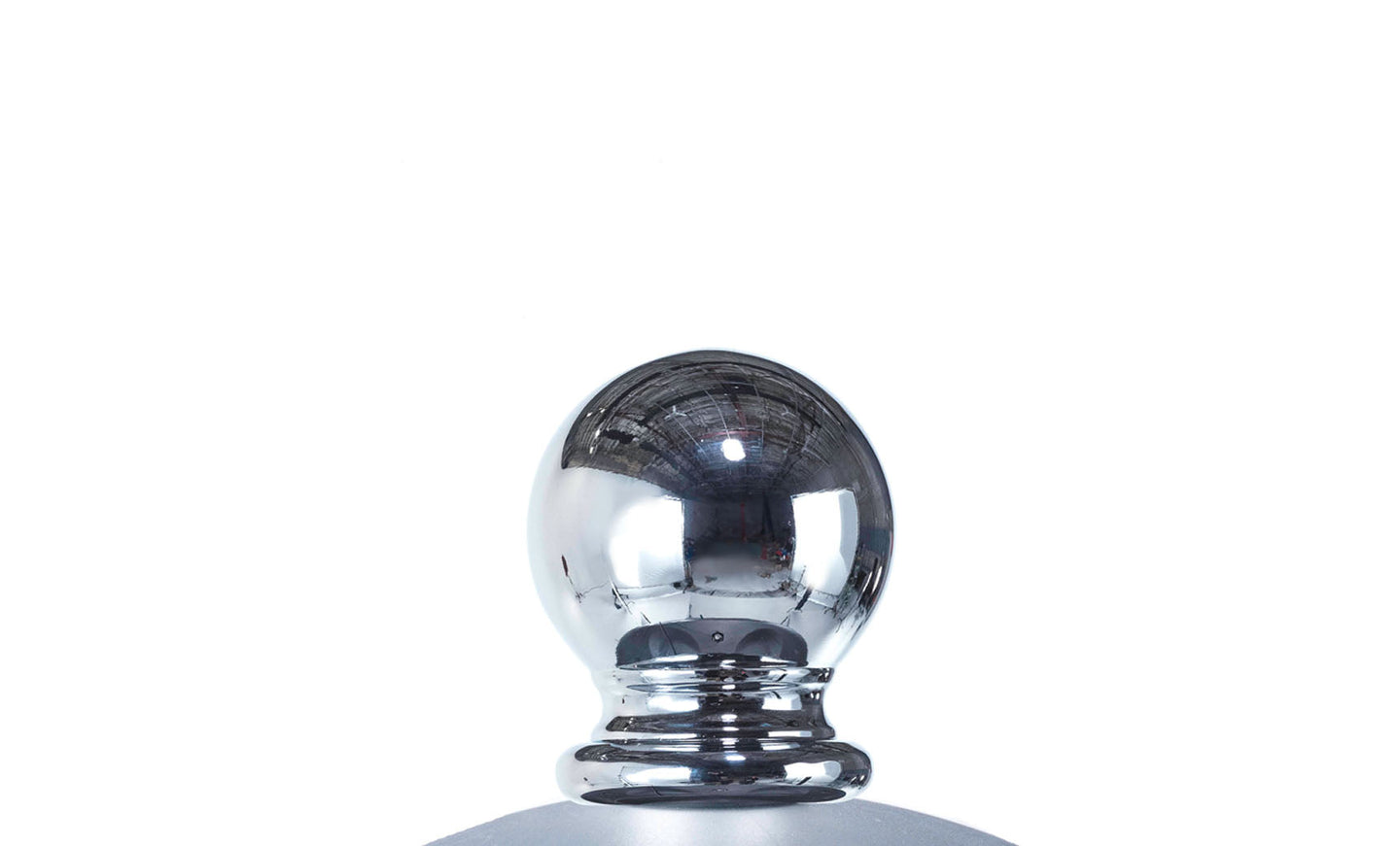 Close-up of a shiny, reflective metallic sphere atop a smooth base, crafted with high-quality materials, highlights the Premier Aluminum Umbrella - 13 Octagon Pulley by Ledge Lounger against a plain white background.