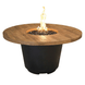 American Fyre Designs Cosmopolitan French Barrel Oak round fire table with weathered finish and two candle holders.