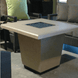 American Fyre Designs Cosmopolitan Square Fire Table with glass top and metal frame in modern design.