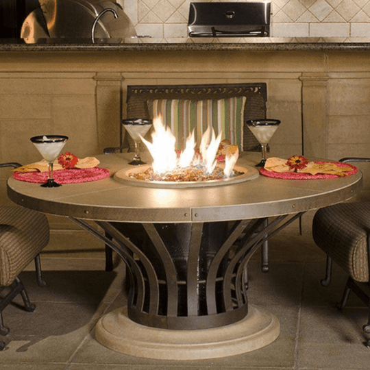 American Fyre Designs Fiesta dining fire table with glass top and stainless steel frame.