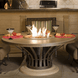 American Fyre Designs Fiesta dining fire table with glass top and stainless steel frame.