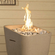 American Fyre Designs CSTN-20-G Fire Pit with greige creekstone surround and glass bowl.