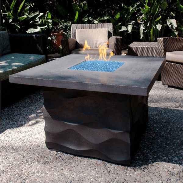 American Fyre Designs The Voro Square Fire Table with glass top and metal frame.