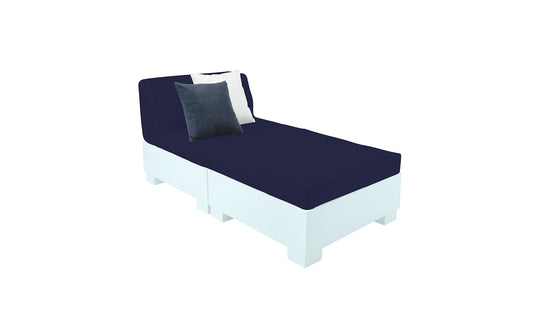 The Affinity 2 Piece Sun Chair by Ledge Lounger features a white base crafted from UV20 resin for outdoor durability, comes with two navy cushions, and a navy seat with decorative white and black pillows set against a plain white background.