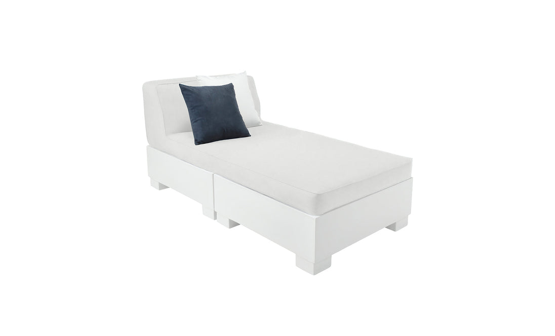 The Affinity 2 Piece Sun Chair by Ledge Lounger is a modern, minimalist white chaise lounge made from UV20 rated resin. It features a black cushion and white pillow, with a sleek rectangular base and backrest, ideal for stylish outdoor settings against a plain white backdrop.