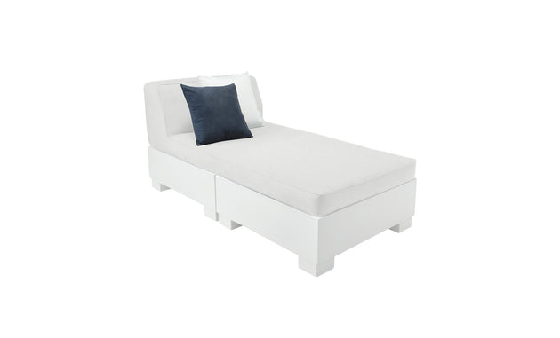 The Affinity 2 Piece Sun Chair by Ledge Lounger is a modern, minimalist white chaise lounge made from UV20 rated resin. It features a black cushion and white pillow, with a sleek rectangular base and backrest, ideal for stylish outdoor settings against a plain white backdrop.
